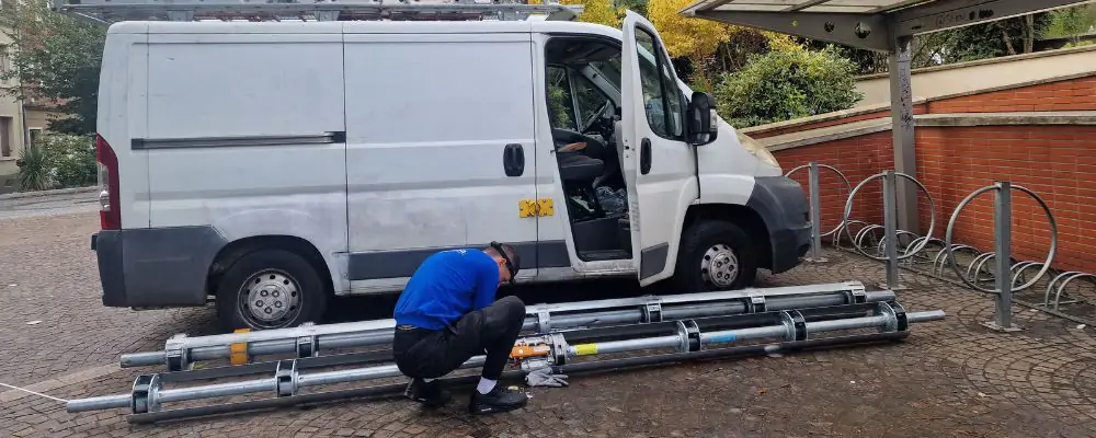 Changement axe motorisé rideau métallique Épinal