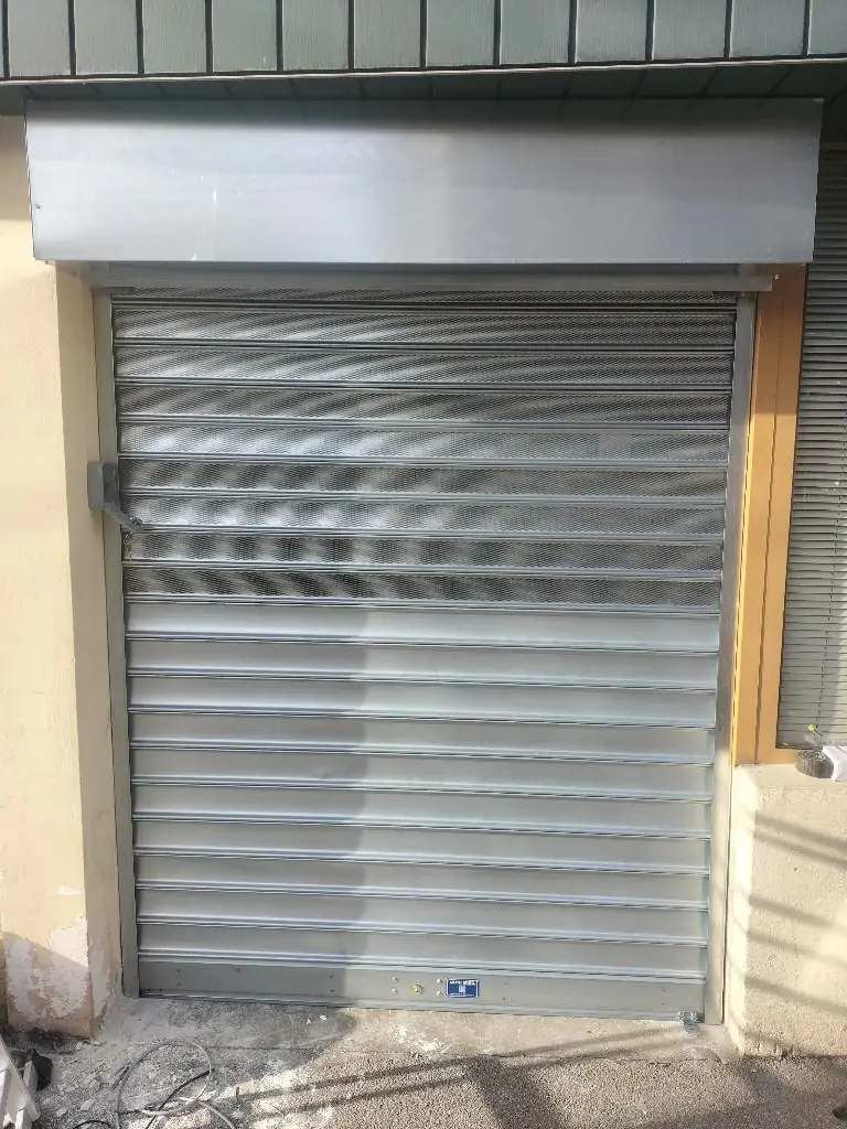 Dépannage rideau métallique micorperforé Barr