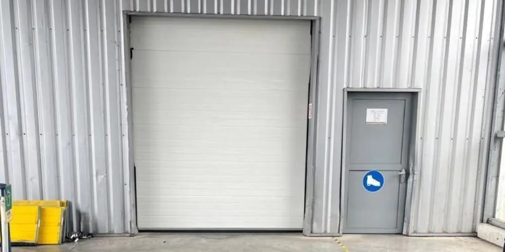 Réparation porte sectionnelle industrielle Boulogne Billancourt 92100
