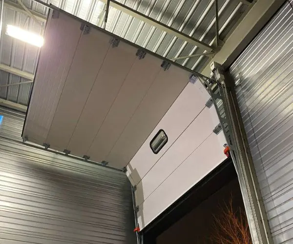 Réparation porte sectionnelle industrielle automatique Neuilly-sur-Marne