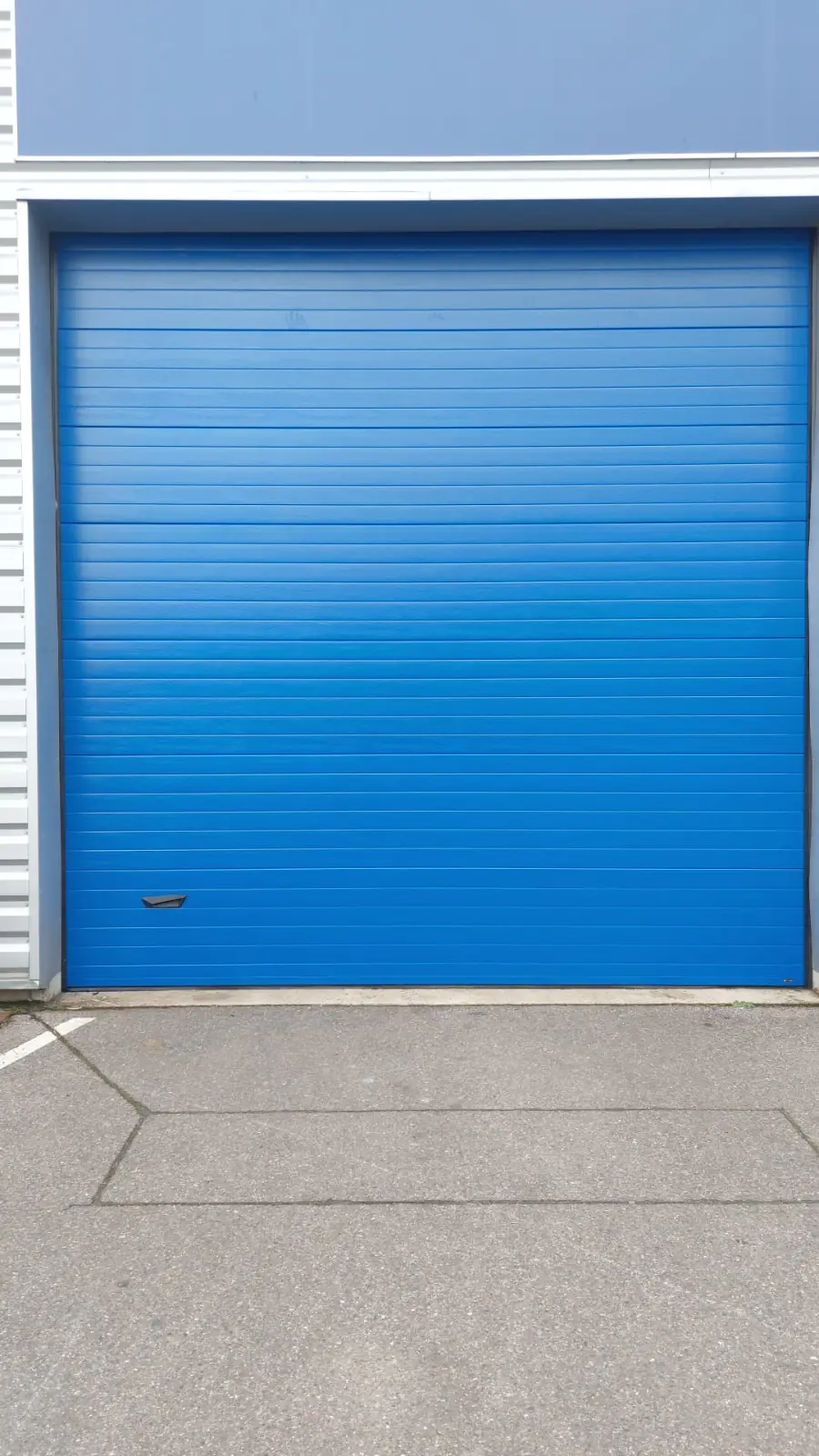 réparation porte sectionnelle industrielle Villeurbanne