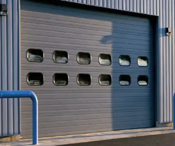Reparation porte sectionnelle industrielle Chantilly