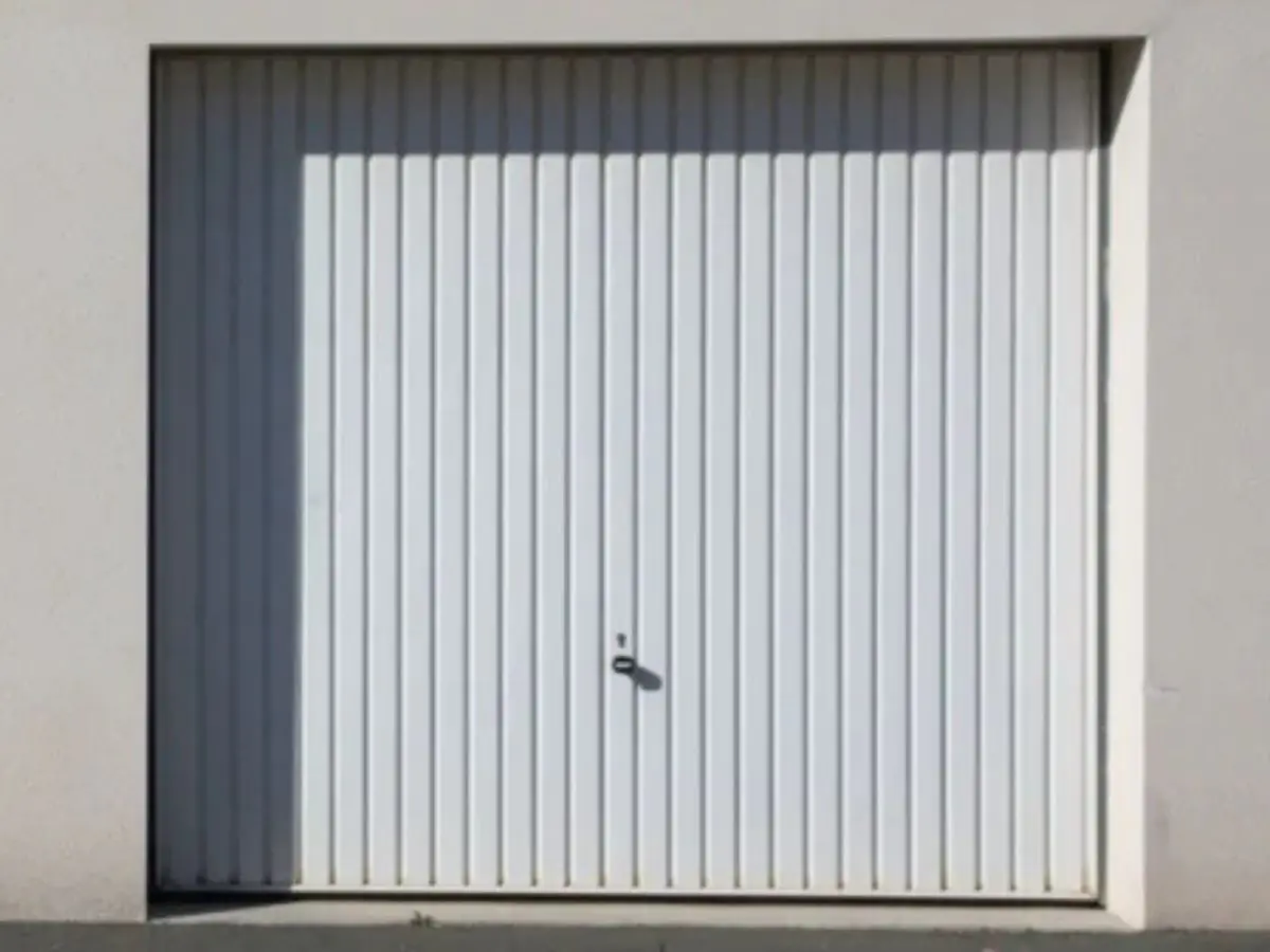 Réparation porte de garage sectionnelle Louviers