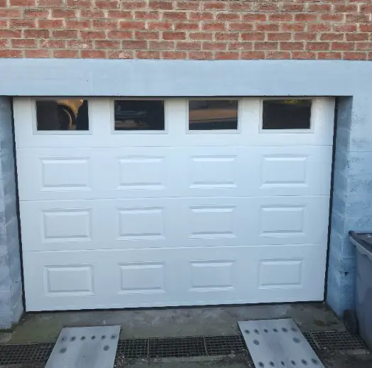 Réparation porte de garage sectionnelle Chenôve 