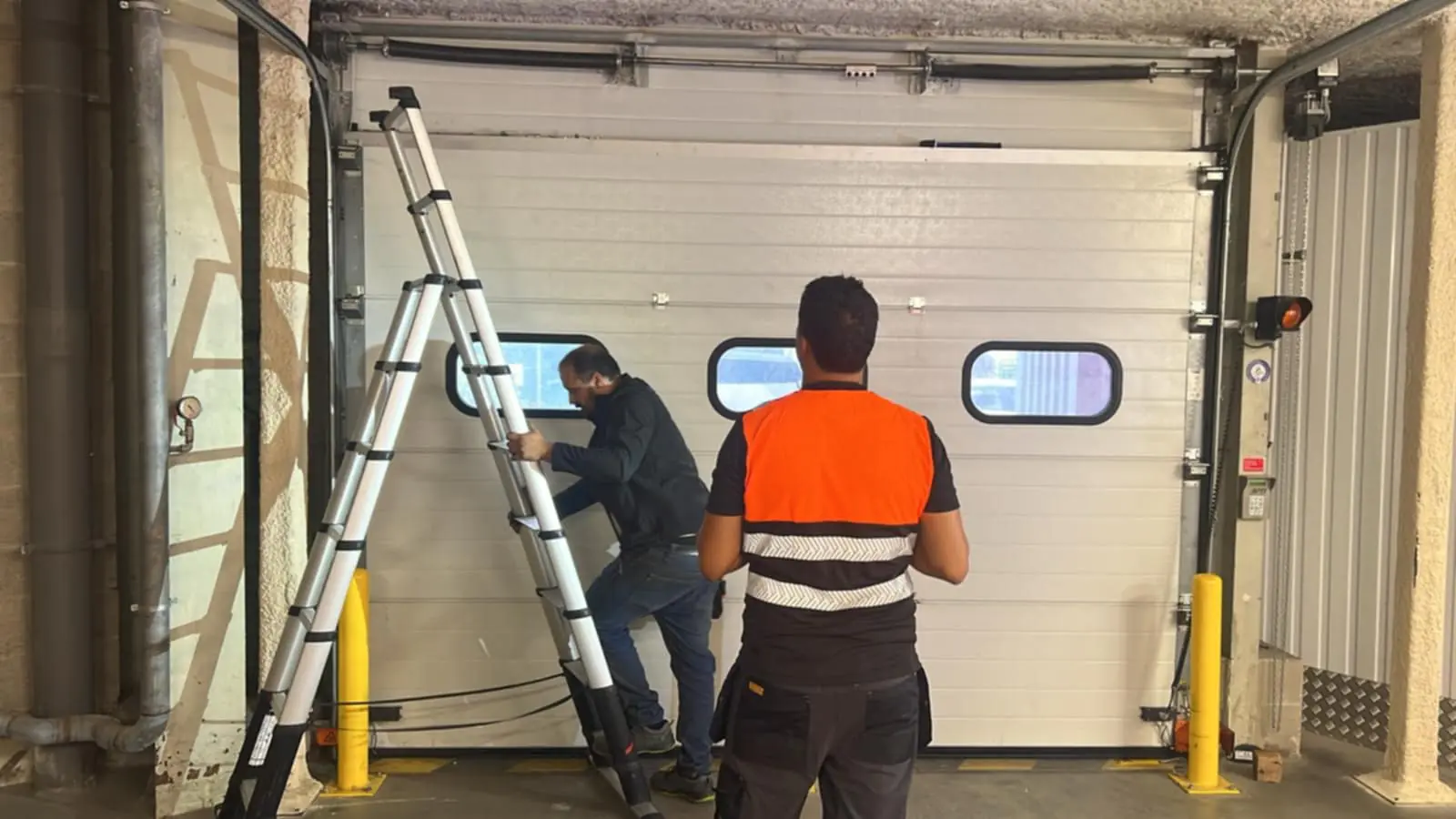 réparation ressort porte sectionnelle industrielle Loos