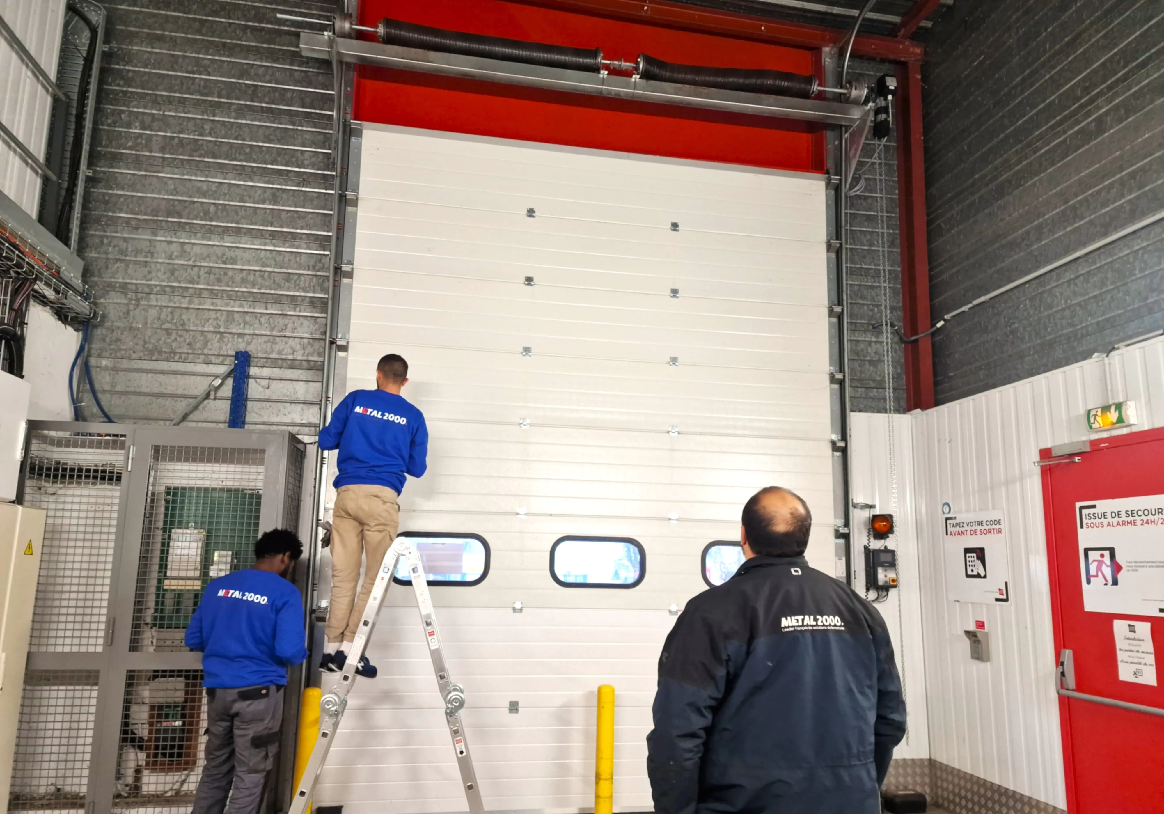 Réparation porte de garage sectionnelle à Meyzieu