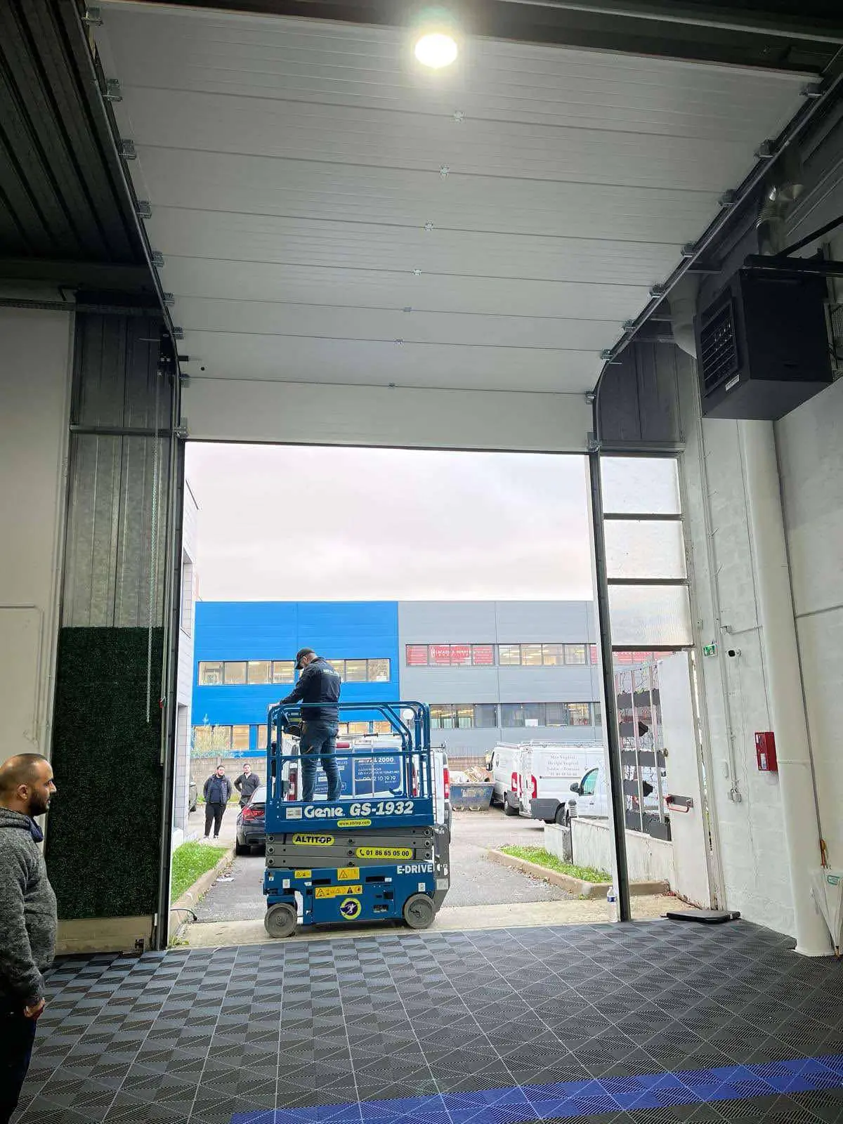 Réparation porte sectionnelle industrielle à Le Plessis-Bouchard
