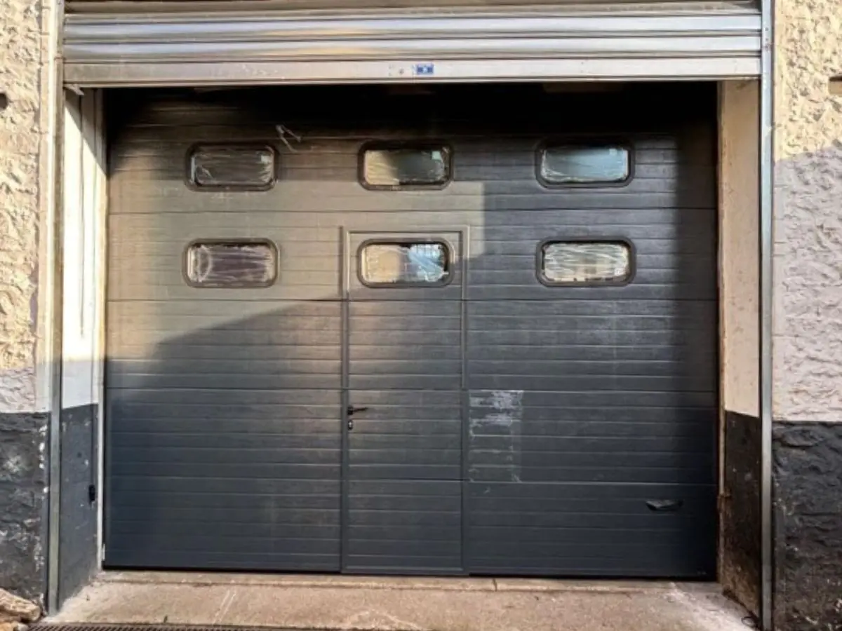 Réparation porte de garage sectionnelle 59140