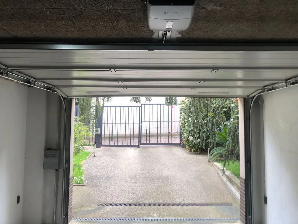 réparation porte de garage sectionnelle Les Mureaux