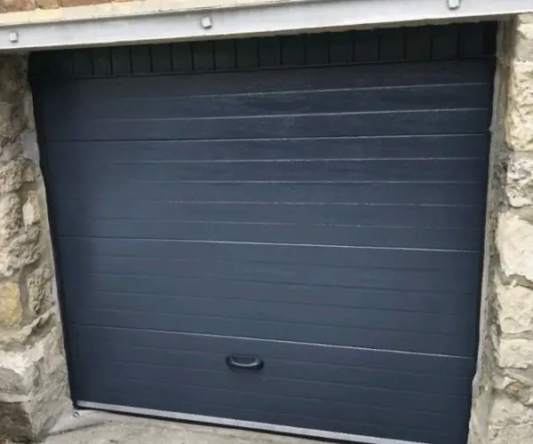 Reparation porte de garage sectionnelle Les Lilas 93260