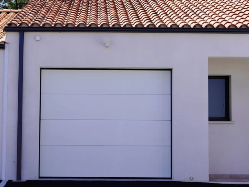 réparation porte de garage sectionnelle Jouy-le-Moutier