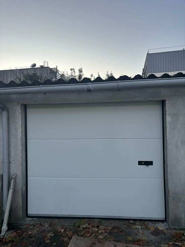  réparation porte de garage sectionnelle à Orgeval 