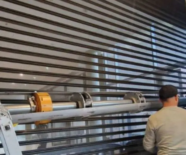 Changement axe motorisé rideau metallique Bry sur Marne 94360 