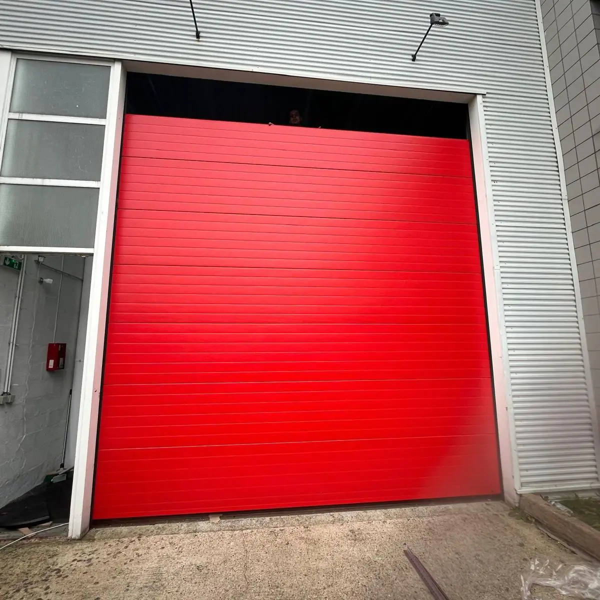 Réparation porte sectionnelle industrielle Malakoff