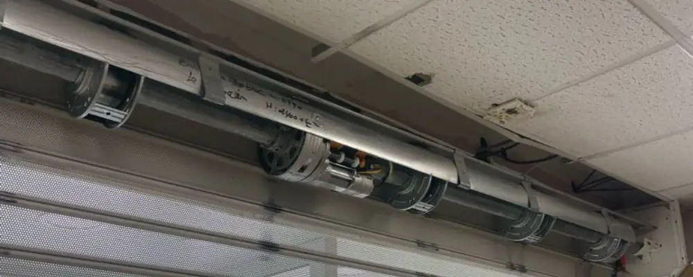 surdimensionnement d'un moteur rideau métallique