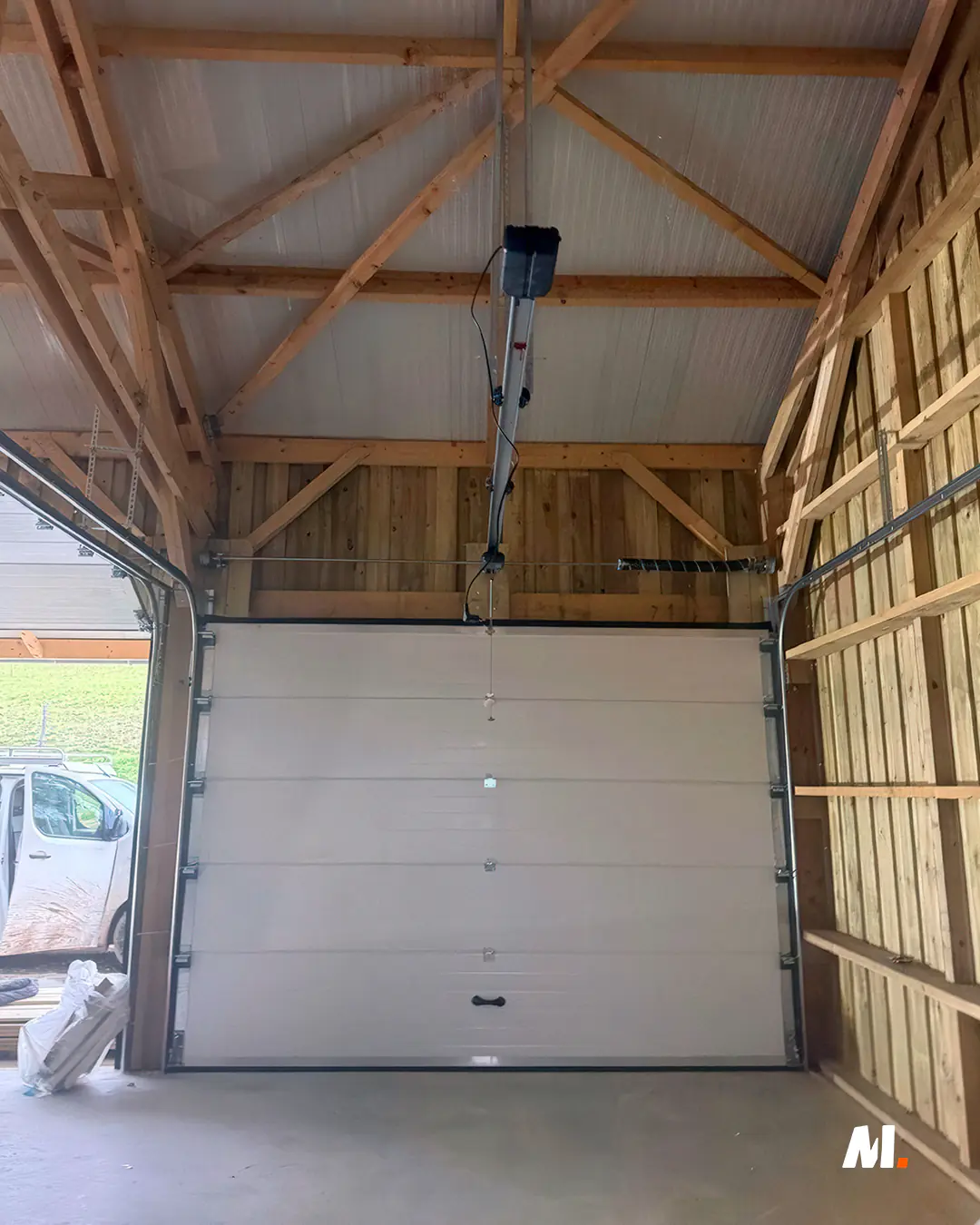 chantier installation porte sectionnelle industrielle motorisée normandie