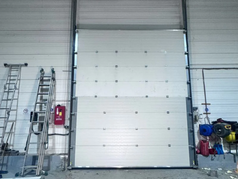 remplacement panneaux porte sectionnelle Thomery