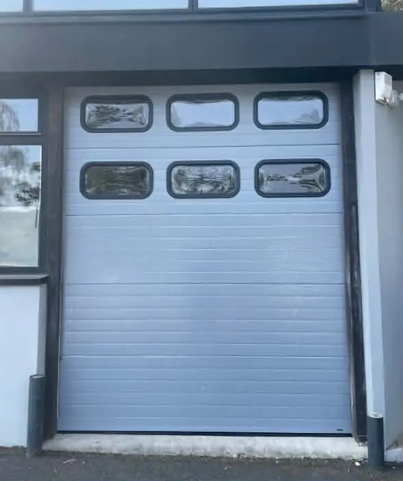 remplacement tablier porte sectionnelle industrielle