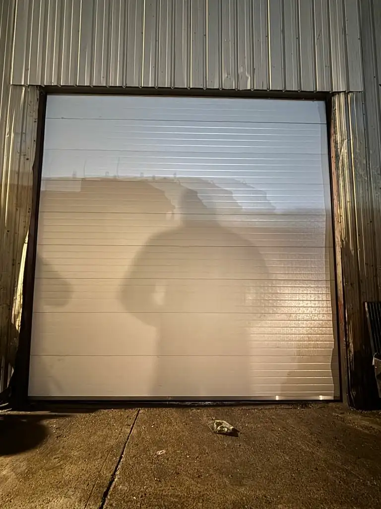 réparation d’une porte sectionnelle bloquée à Villenoy