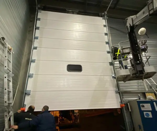 Motorisation porte sectionnelle industrielle Reims 51100