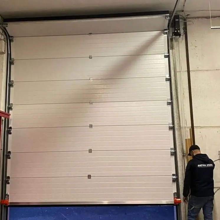 Réparation porte sectionnelle industrielle Dugny 93440