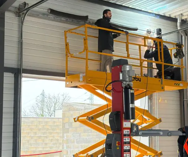 Réparation porte sectionnelle industrielle Vaujours