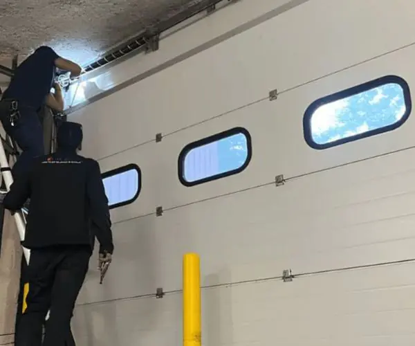 Réparation porte sectionnelle industrielle Villetaneuse 93430