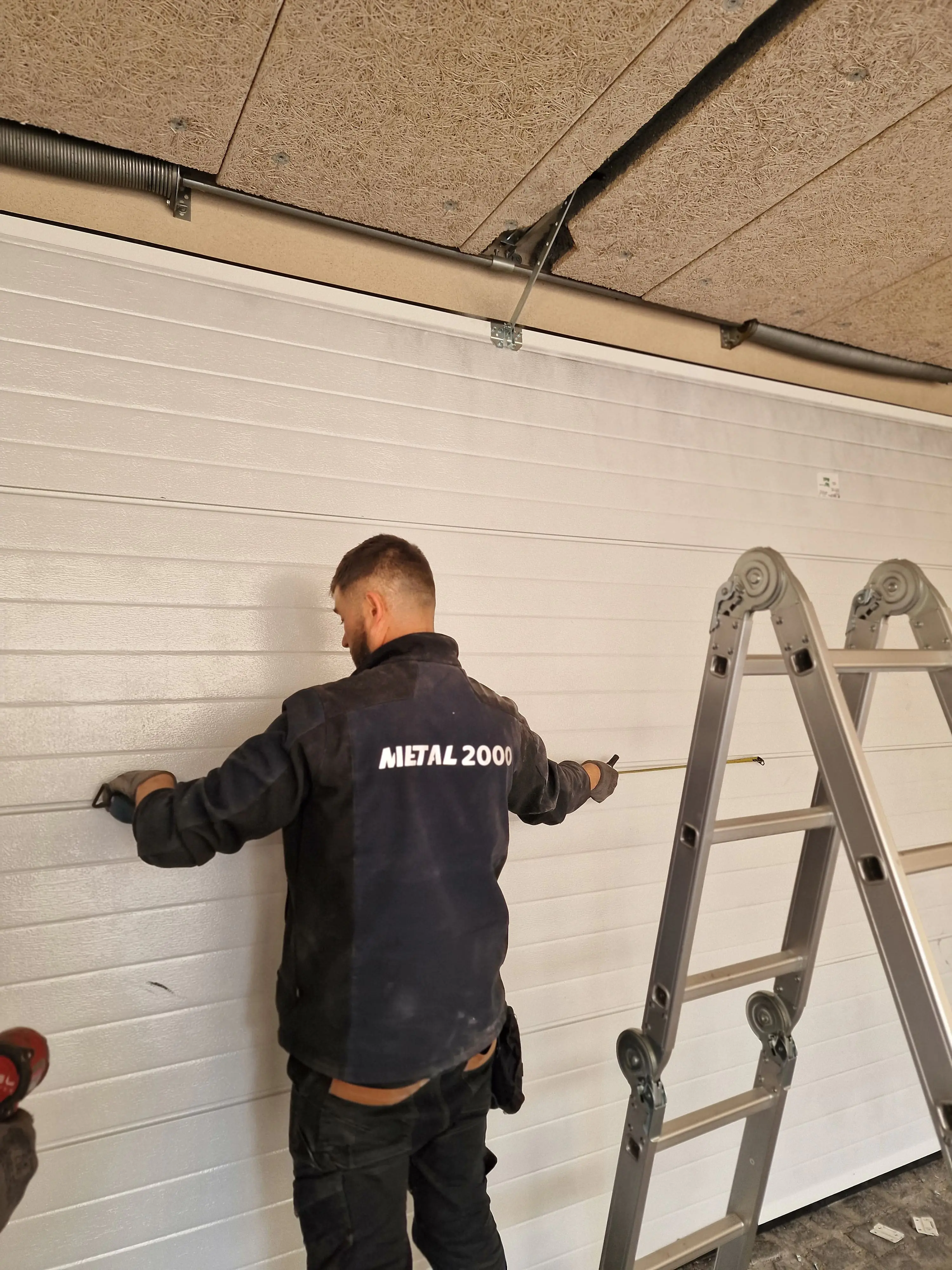 Réparation porte de garage sectionnelle Blancs-Coteaux