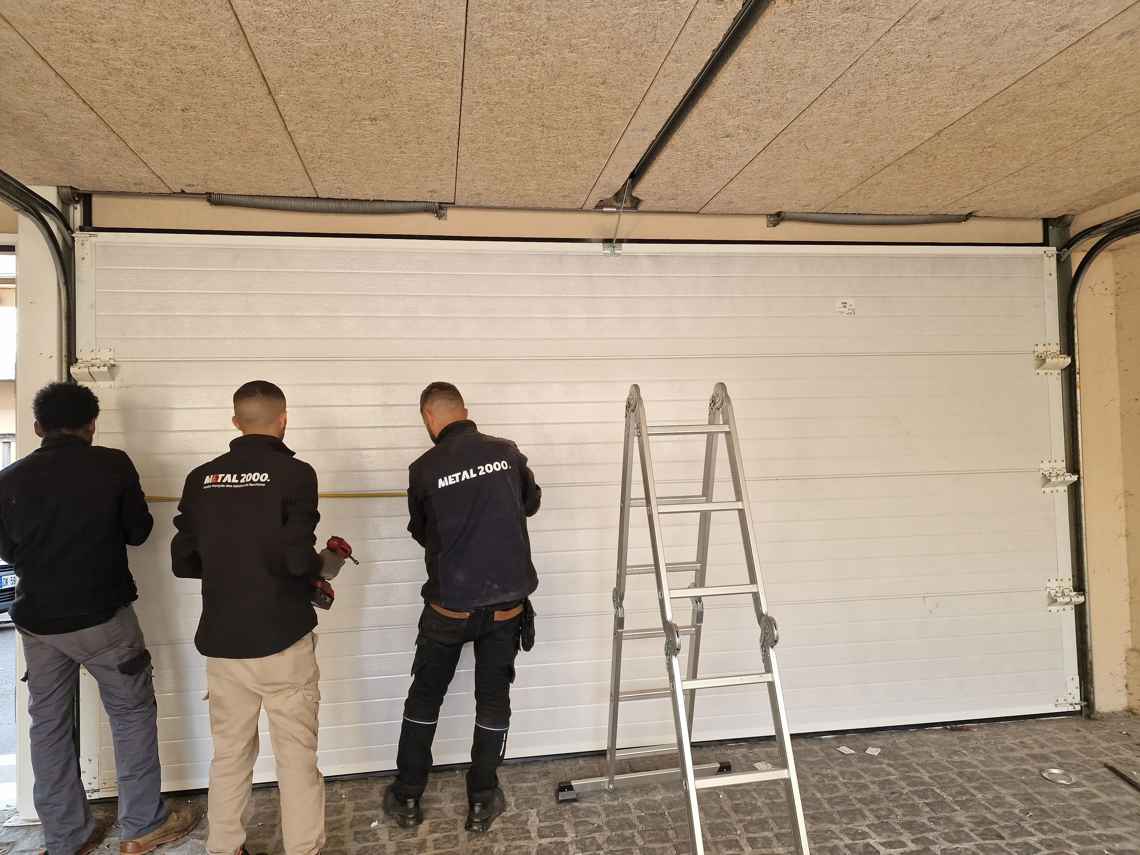  réparation porte de garage sectionnelle Blancs-Coteaux 