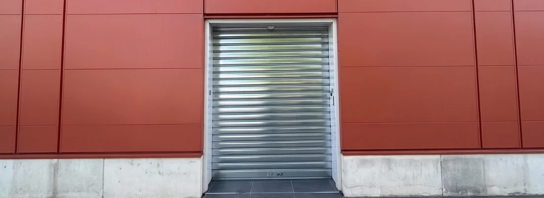 Remplacement d'un tablier et d'un axe motorisé de rideau métallique pour M'CHADAL (Optical Center) à L'Isle-Adam (95)