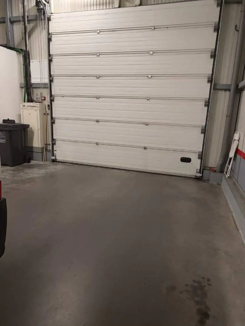 Remplacement d'une paire de câbles et de remise en service d'une porte sectionnelle fere-champenoise