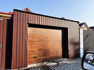 Réparation porte de garage sectionnelle Hermonville