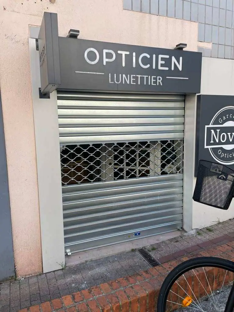changement axe motoriser rideau métallique Ris Orangis