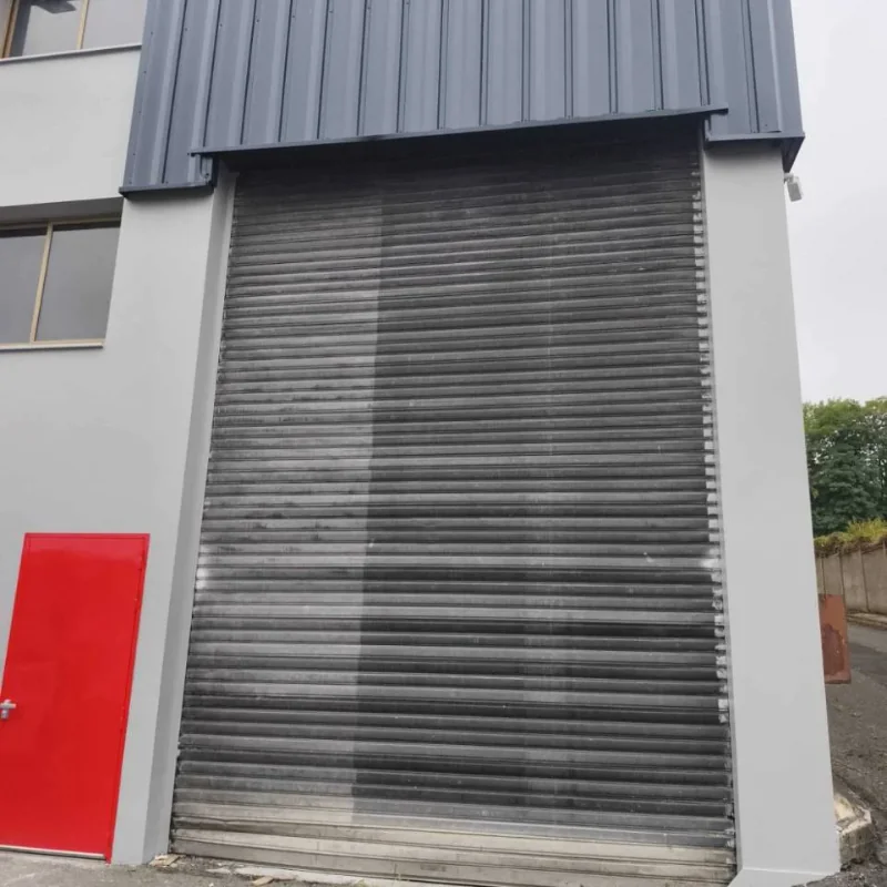 Remplacement d'un rideau métallique par une porte sectionnelle industrielle pour HOMEBOX à Franconville
