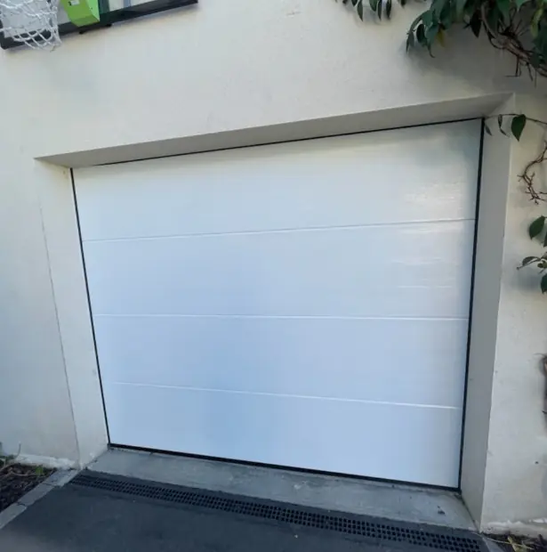 réparation porte de garage sectionnelle à La Rivière-de-Corps